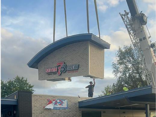 Crane drops 7brew sign on top of building