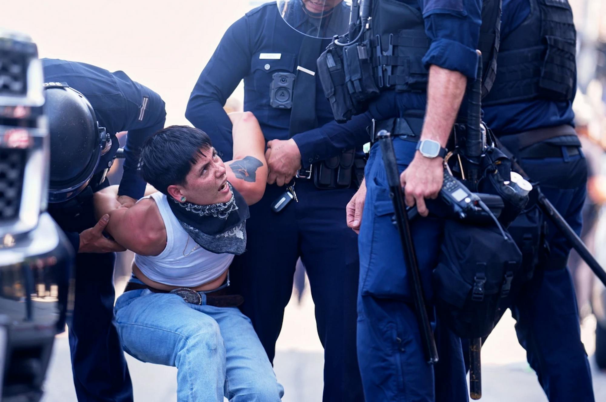LA Riots. Protestor is detained.png
