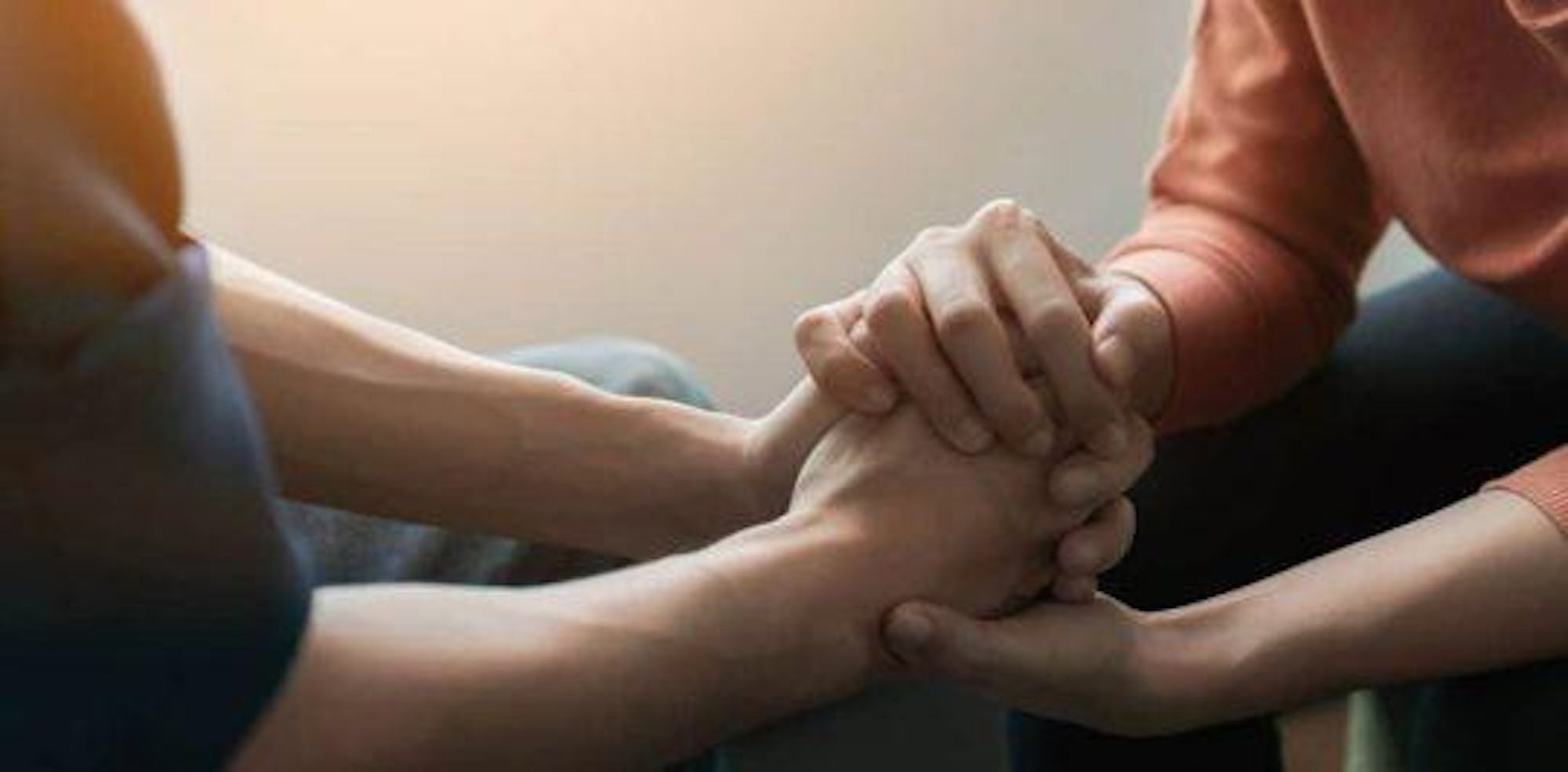 Two People Holding Hands